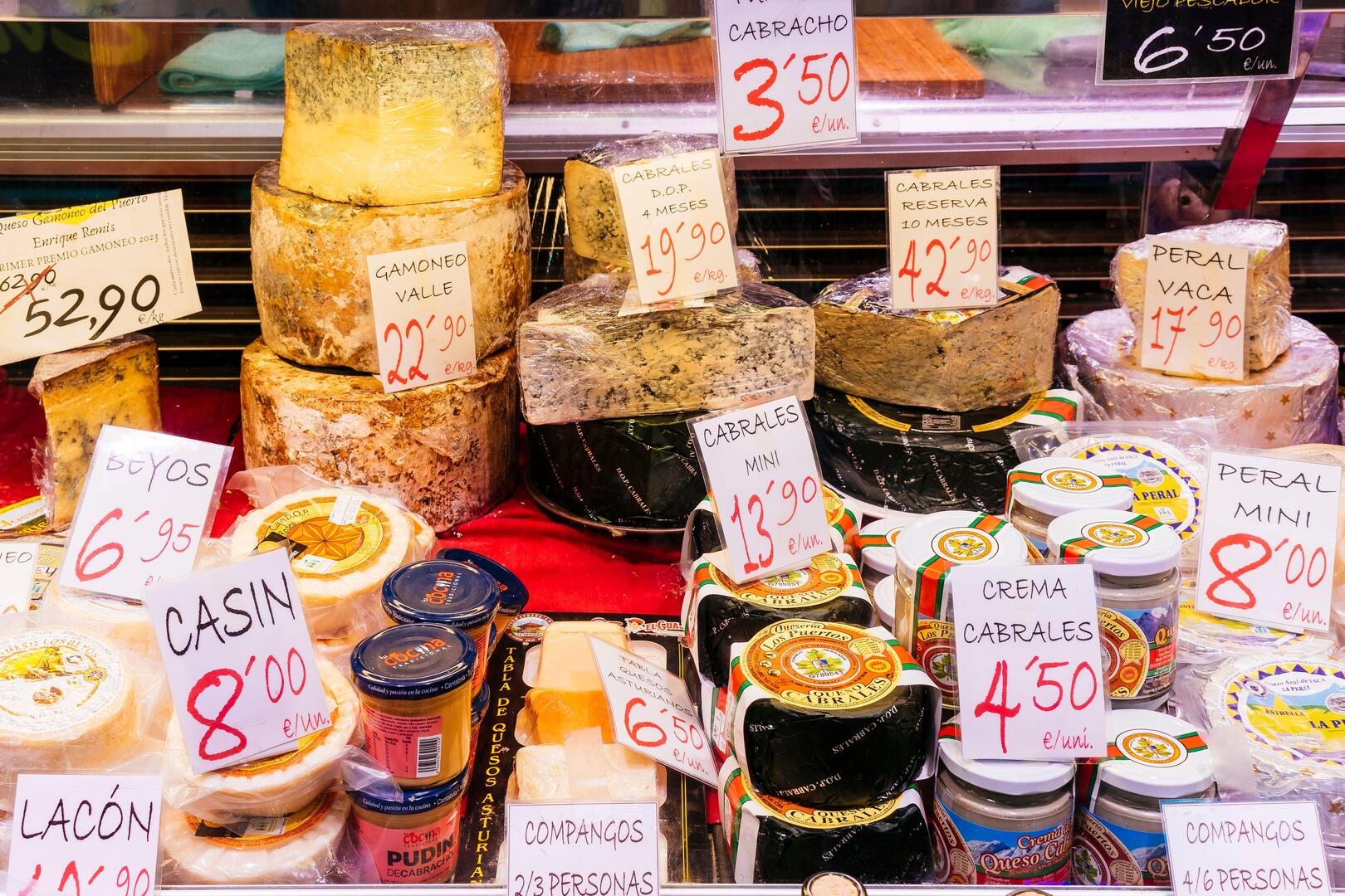 Selection of Asturian cheeses at El Fontan Market in Oviedo, Spain.