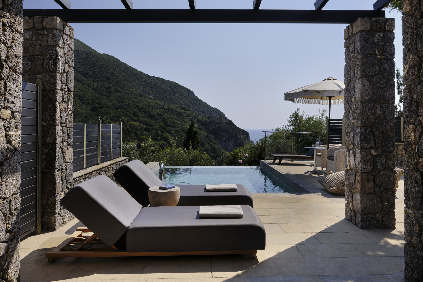 Two loungers by a private pool outside a guest room at Atlantica Grand Mediterraneo Resort