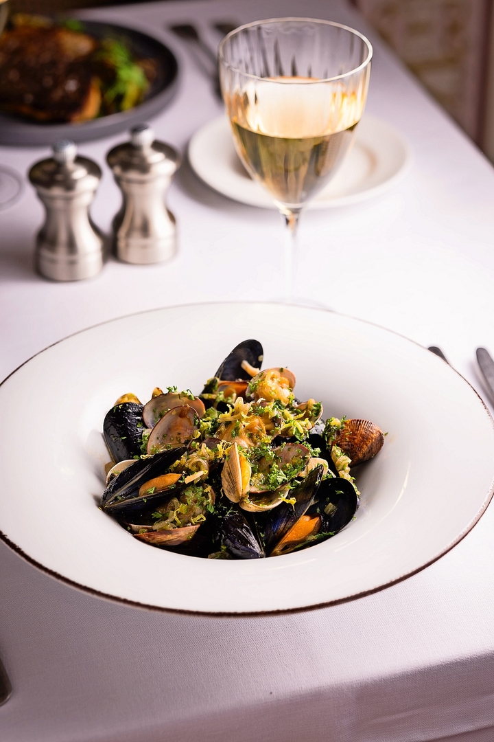 Mussels and clams served in a parsley sauce.