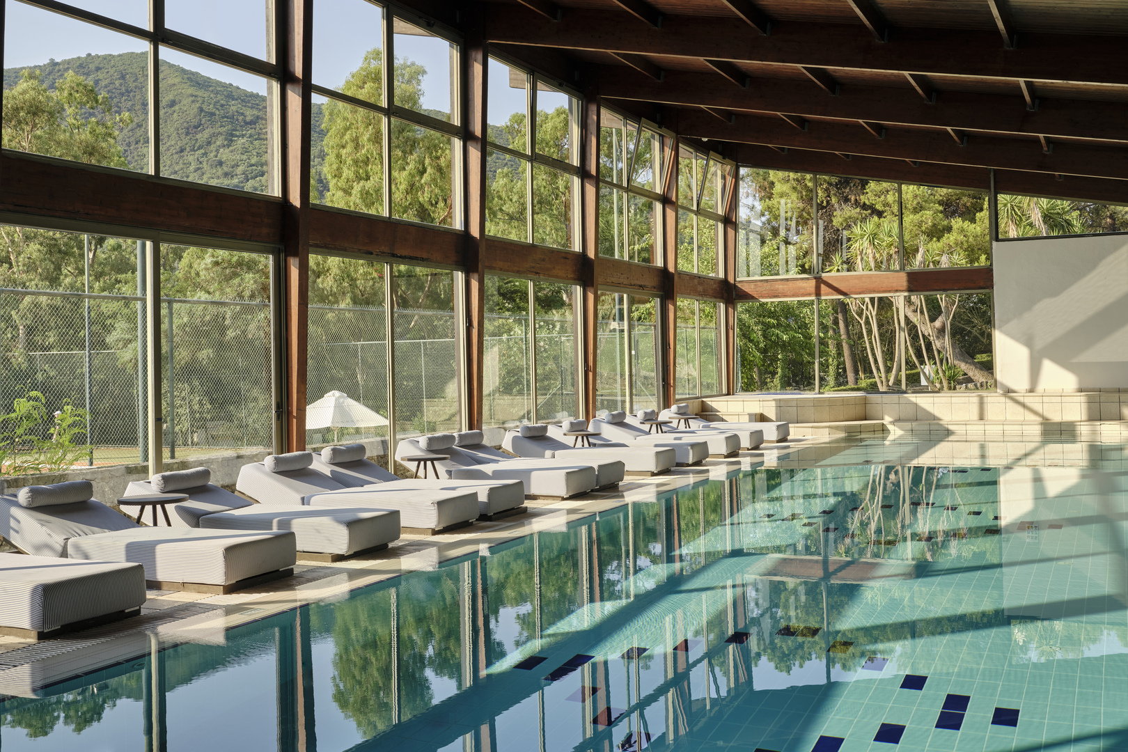 Loungers line an indoor swimming pool at Atlantica Grand Mediterraneo Resort