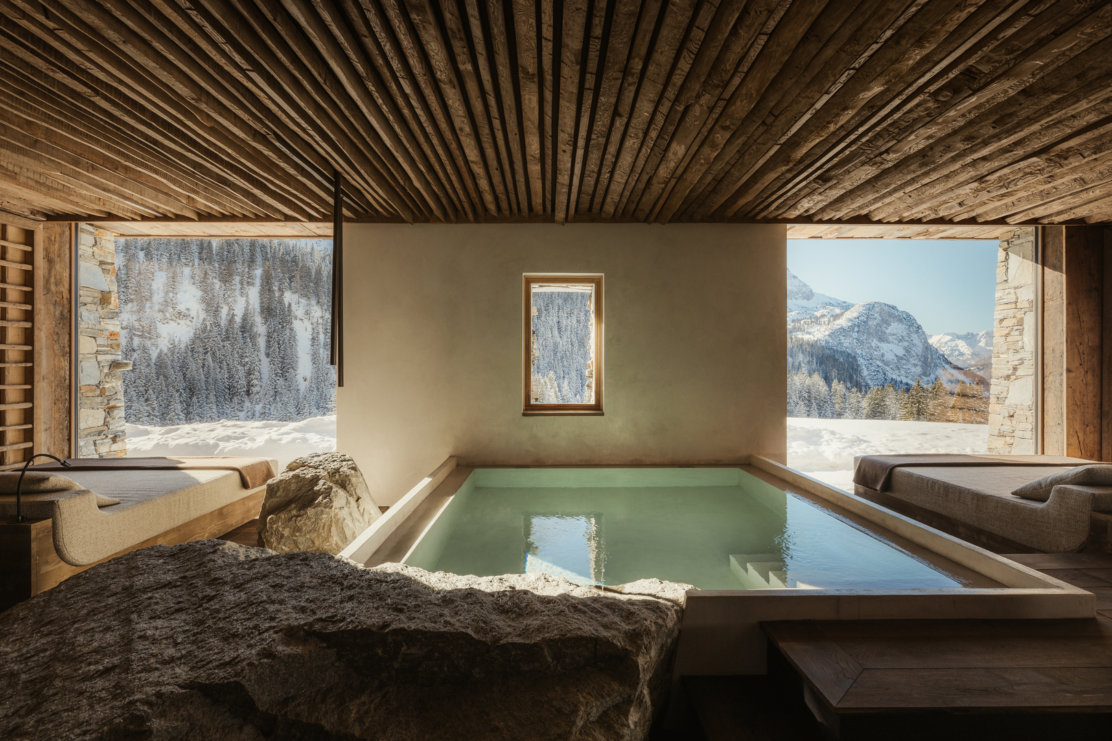 Indoor pool with mountain views.